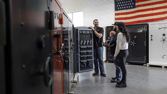 People discussing safe options in a store with an American flag in the background.