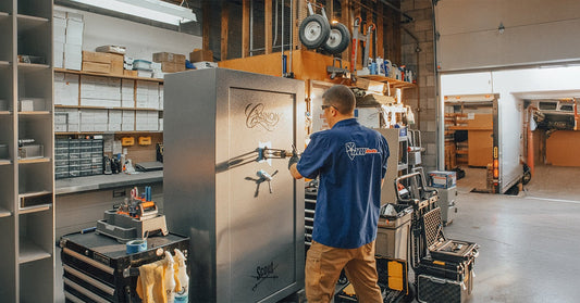 jeff working on a safe in the shop