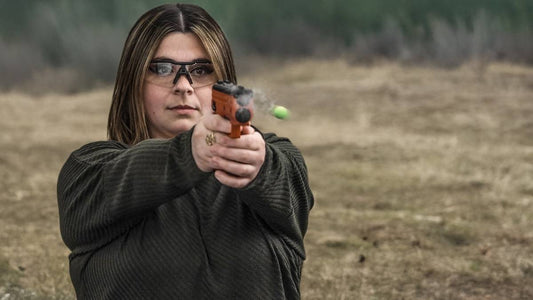 woman shooting a Byrna